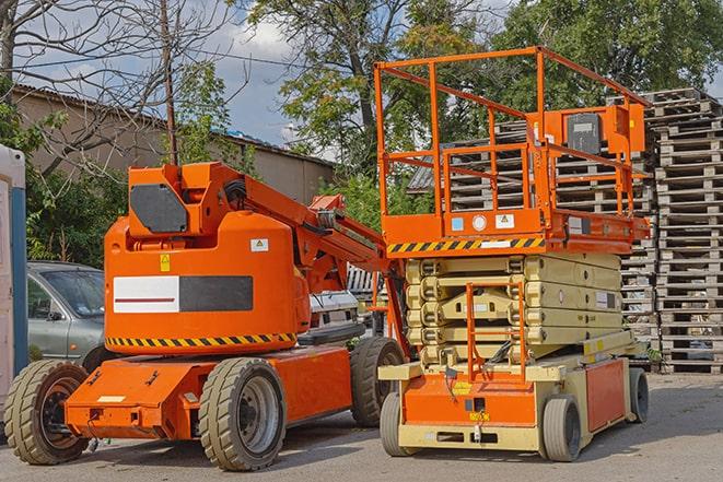 warehouse forklift in action with neatly arranged pallets in Blaine